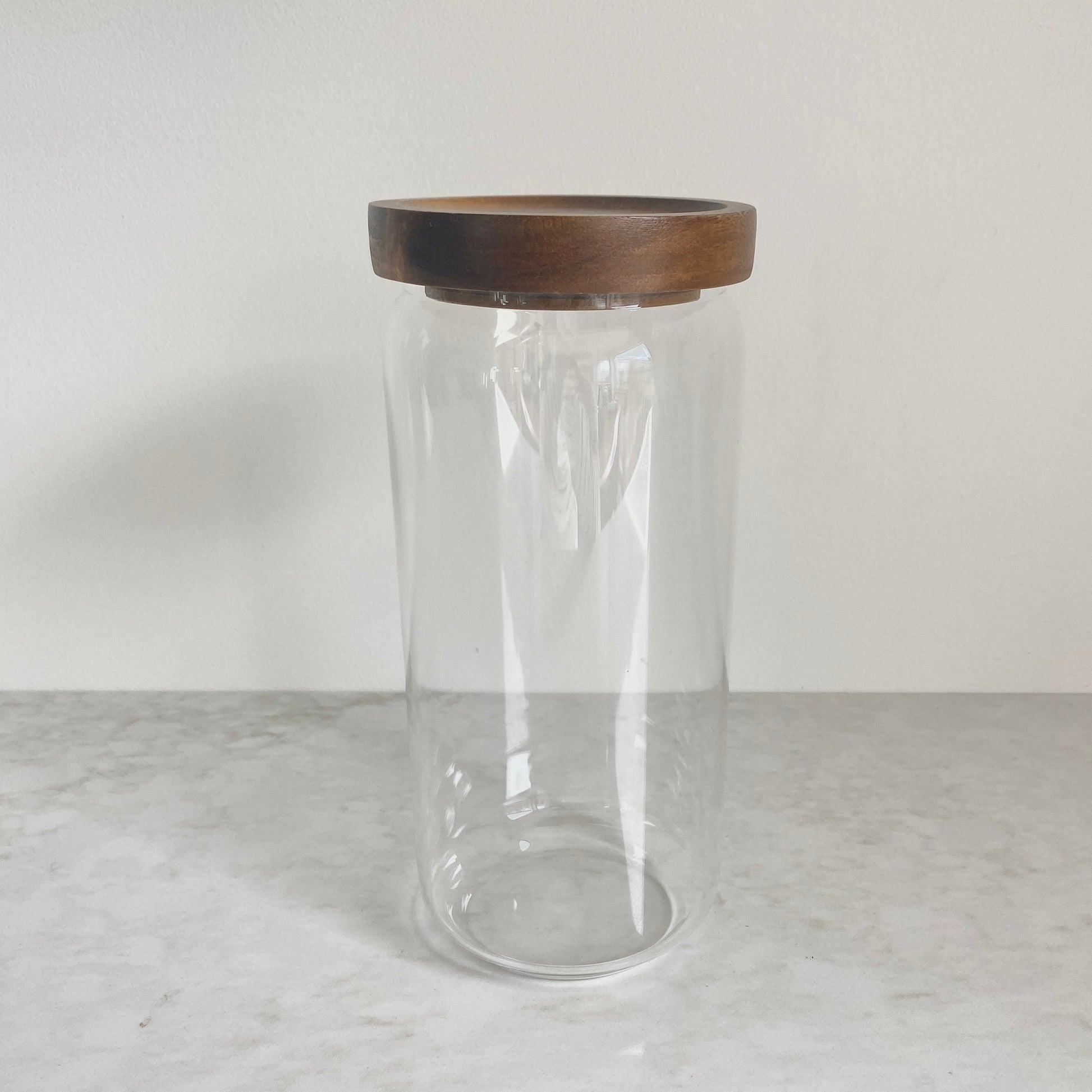 Large size glass canister with acacia wood lid side view