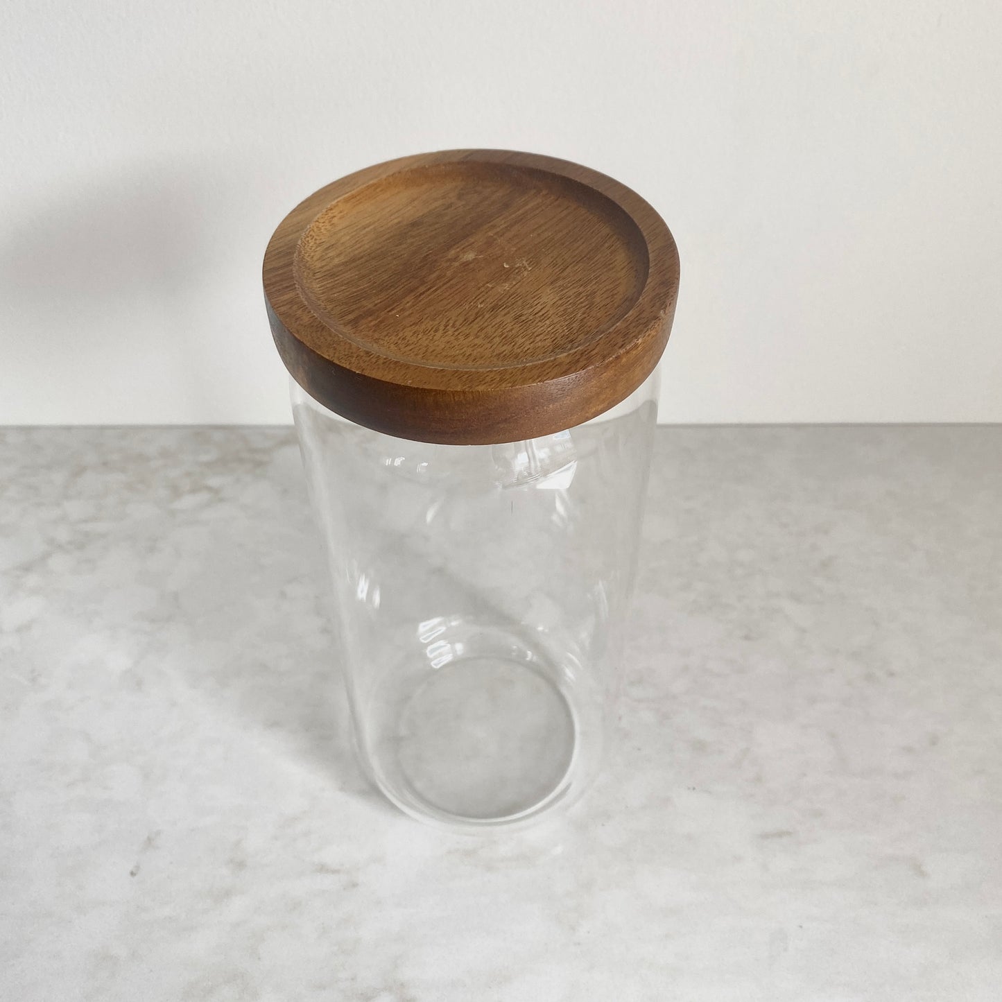 Large size glass canister with acacia wood lid top view