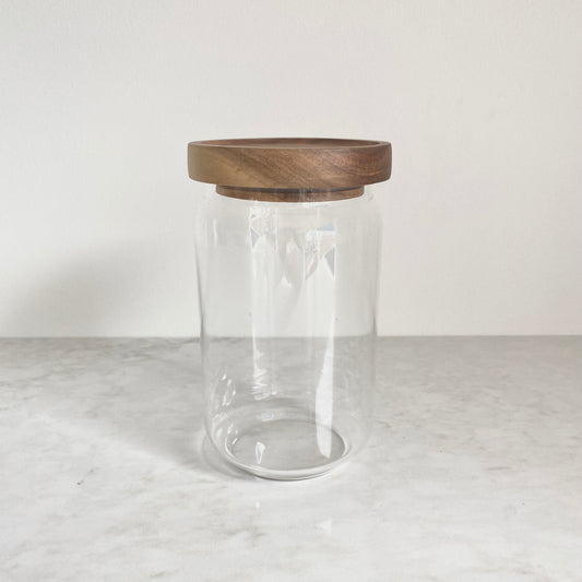 Medium size glass canister with acacia wood lid pictured from the side