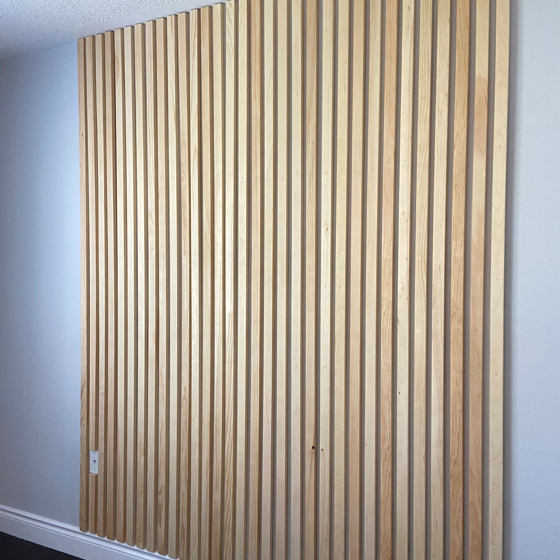 Angled view of final DIY wood slat project